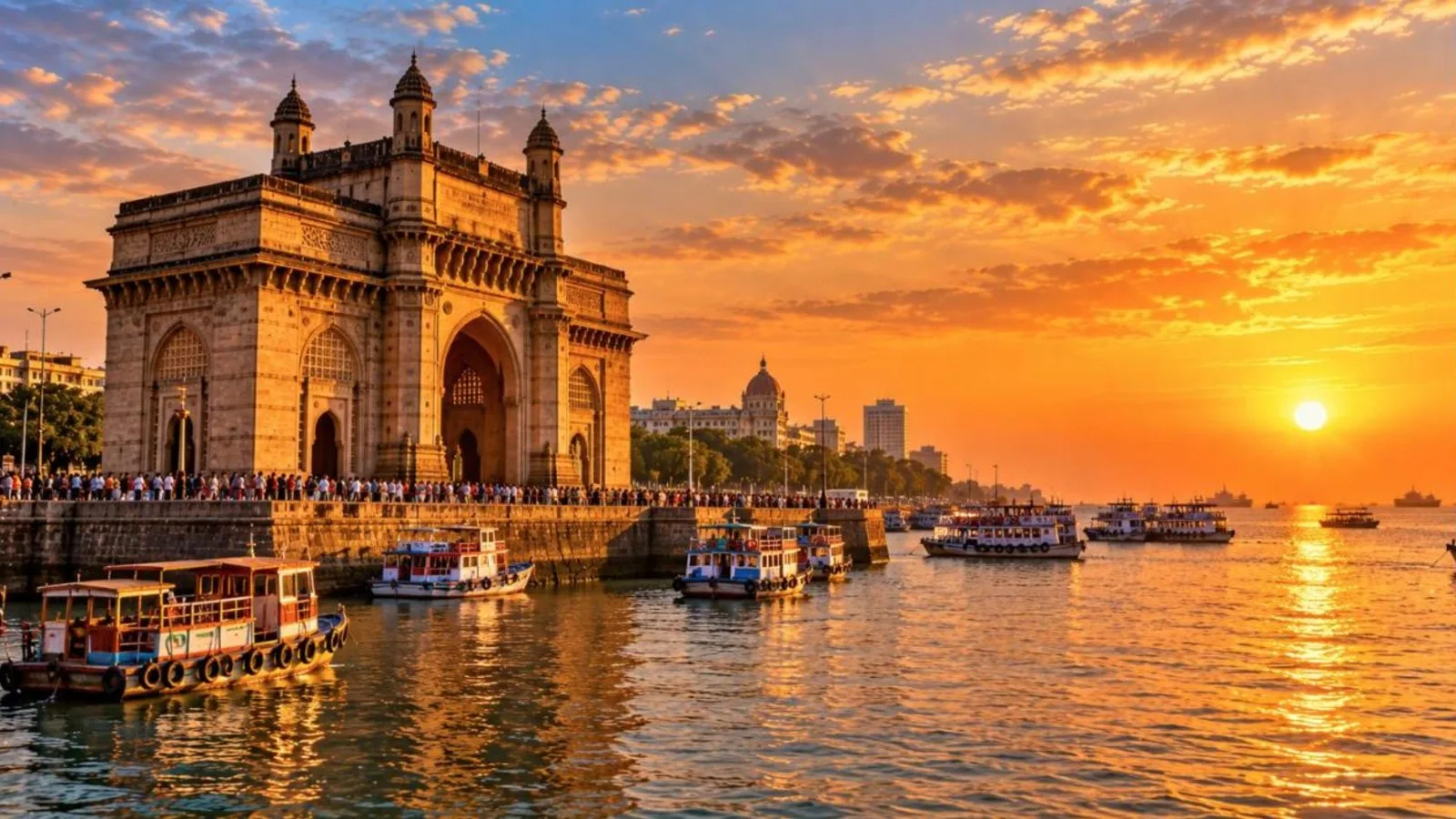 Gateway of India in Mumbai at sunset with boats in the harbour
