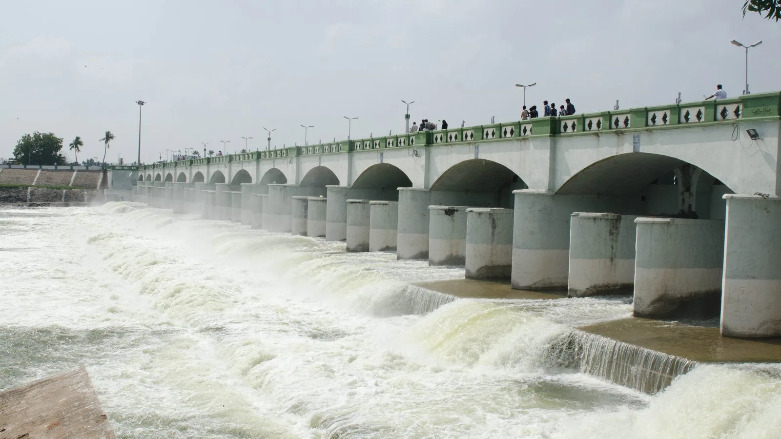 Kaveri river water foaming as it pours beneath the arched bridge of the Kallanai (Grand Anicut) in Thanjavur district, Tamil Nadu