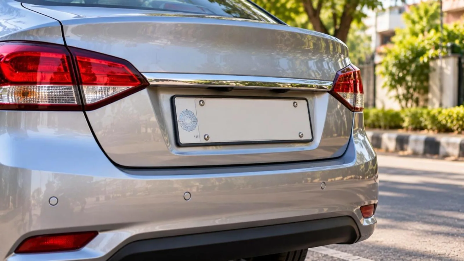 Rear of a silver car with a blank high security registration plate and hologram
