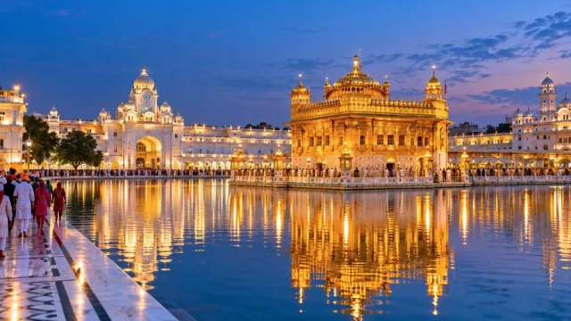 The Golden Temple in Amritsar reflected in the sacred pool at dusk
